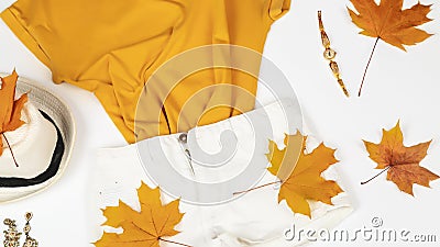 Autumn comes. Fashionable women's clothing autumn outfit. Fashionable shorts, t-shirt. trendy mood. Creative Flatlay Autumn Stock Photo