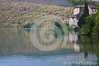 Autumn comes on Lake Toblino and its castle Stock Photo