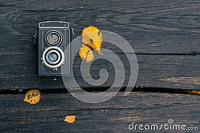 Autumn concert, retro camera on a autum background Stock Photo