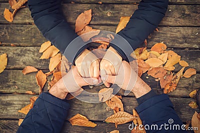 Autumn couple holding hands top view.Autumnal relationship love concept Stock Photo