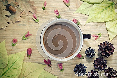 Autumn cozy background - cup of coffee with milk, autumn yellow leaves, wooden background. Autumn still life concept Stock Photo