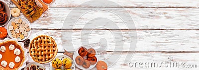 Autumn desserts corner border with assorted traditional fall sweet treats over a white wood banner background Stock Photo