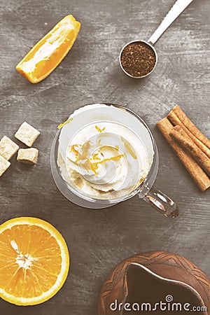 Autumn drink of coffee with orange juice and cream on dark background. Top view. Food background. Toned Stock Photo