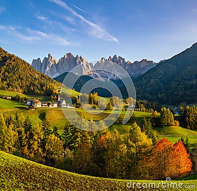 Autumn evening Santa Magdalena famous Italy Dolomites village view in front of the Geisler or Odle Dolomites mountain rocks Stock Photo