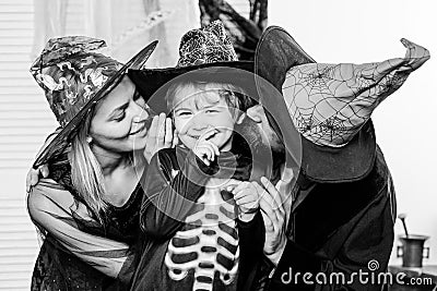 Autumn family love. Traditions for October 31. Mother, son and father celebrate Halloween. Holiday for Toddler. Happy Stock Photo