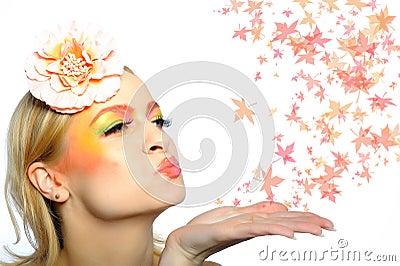 Autumn fashion woman blowing autumn leafs Stock Photo