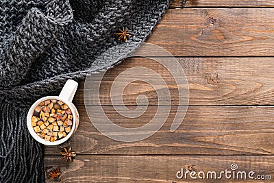 Autumn flatlay composition with cup of herbal tea and wool plaid. Cozy home, hygge concept. Flat lay, top view, copy space Stock Photo