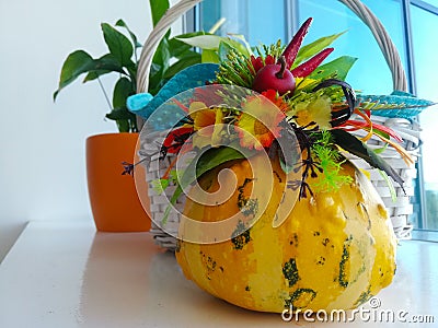 Autumn floral bouquet in a pumpkin vase. Bright autumn composition for Halloween Stock Photo