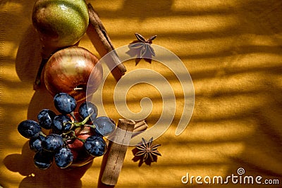 Autumn food with copy space and trendy shadows. Creative fruits photography: group of grapes, apples, star anise and Stock Photo