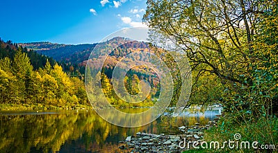 Autumn forest and sky and mountains and river Stock Photo