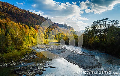 Autumn forest and sky and mountains and river Stock Photo