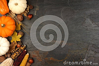 Autumn harvest side border over a slate background Stock Photo