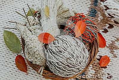 Autumn knitting of warm clothes. Woolen balls of knitting needles. Self-made things with love. Idea for handmade gifts Stock Photo