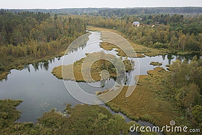 Autumn lake and island surrounded by forest Izvara park and ecological trail, Volosovsky district, Leningrad region Russia. Stock Photo