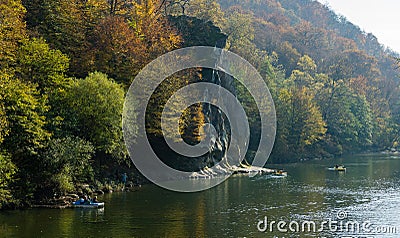 Autumn landscape with Cockerel rock of mountain river Psekups. People ride pedal catamarans Sunny day in resort area Editorial Stock Photo