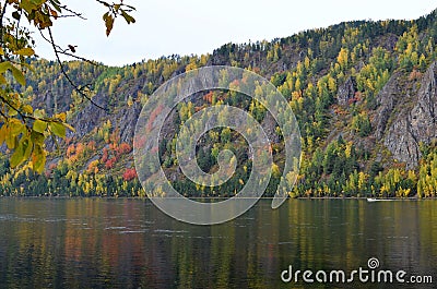 Autumn landscape of the mountain with bright autumn colors view from the river Bank Stock Photo