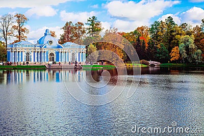 Autumn landscape with view over a garden pavilion `Grotto` and the humpback bridge in the Catherine Park, Pushkin, Saint Editorial Stock Photo