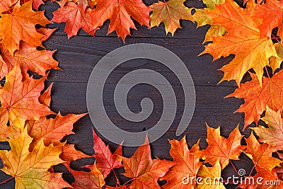 Autumn leaf on wood black background orange leaf on old grunge wood deck, copy place for inscription, top view, tablet for text Stock Photo