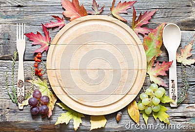 Autumn leaves and empty cutting board food fall background concept Stock Photo