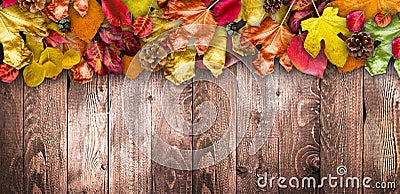 Autumn Leaves over a Natural Dark Wooden background. Old dirty wood tables or parquet Stock Photo