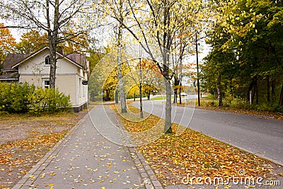 Autumn leaves on walkway in old museum district of Kouvola, Finland Editorial Stock Photo