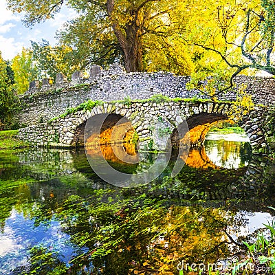 Autumn mood - ancient bridge in Ninfa park Stock Photo