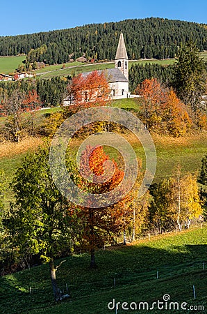 Autumn morning Santa Magdalena famous Italy Dolomites mountain village church Stock Photo