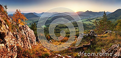 Autumn mountain panorama landcape with forest at sunset Stock Photo