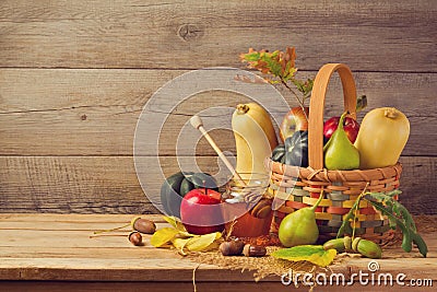 Autumn nature concept. Fall fruits and pumpkin on wooden table. Thanksgiving dinner Stock Photo