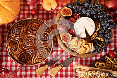 Autumn outdoor picnic set or dinner for celebration Thanksgiving Day. Holiday party. Festive table. Snacks, fruits, pie, Stock Photo