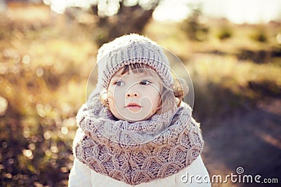 Autumn outdoor, toddler girl walking outdoors. Stock Photo