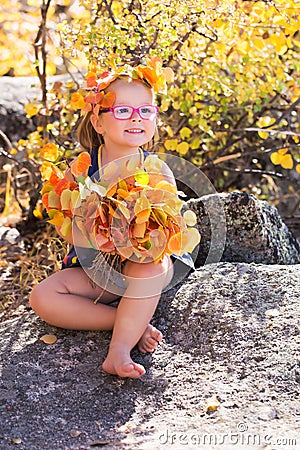 Autumn portrait baby holding yellow Leaves Stock Photo