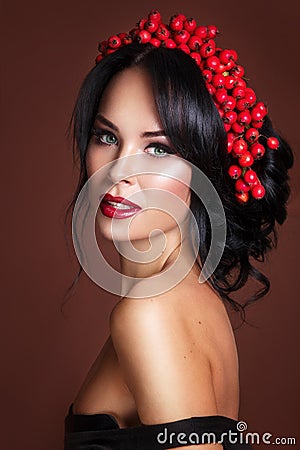 Autumn Portrait of Beautiful Woman Fashion Model with Fall Leaves and Rowan Wreath Stock Photo