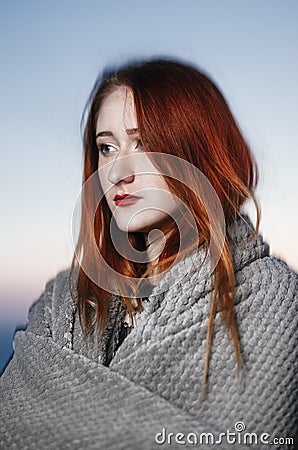 Autumn portrait of beauty redhead girl outdoors in twilight. Stock Photo