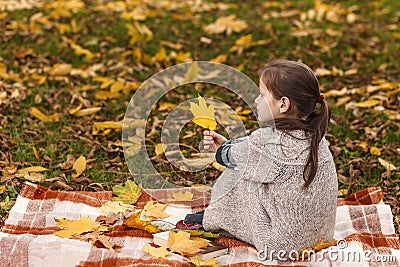 Autumn portrait lonely girl in the autumn park. Stock Photo