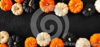 Autumn pumpkin double border banner in Halloween colors orange, black and white against a black background Stock Photo