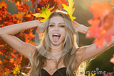 Autumn romance woman with leaves. Female model on foliage day. Dream and lifestyle. Beauty outdoor portrait. Carefree Stock Photo