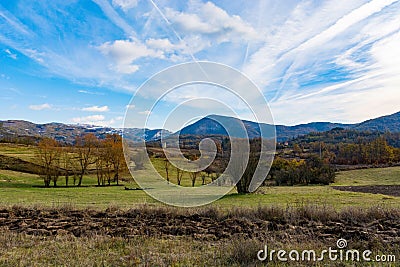 Autumn's Tapestry: Village Landscape Embraced by Nature Stock Photo