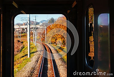 Autumn scenery along train tracks seen from driver room window Editorial Stock Photo