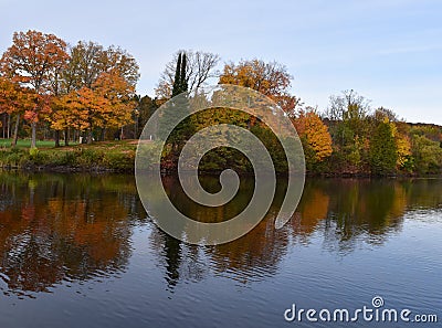 Shore of a north woods lake on a fall morning Stock Photo