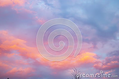 Autumn sky with colorful clouds of pink, magenta and yellow shades Stock Photo