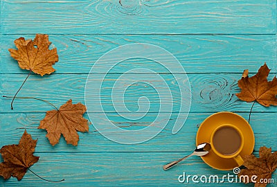 Autumn still life - coffee with leaves on a blue wooden background. Stock Photo