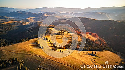 Autumn sunset in mountains. Colorful fall woodland. Stock Photo