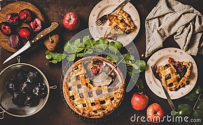 Flat-lay of apple and plum pie and tea setting Stock Photo