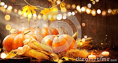 Autumn Thanksgiving pumpkins over wooden background