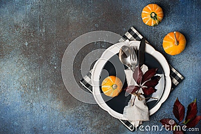 Autumn thansgiving and halloween tableware flat lay with plate and pumpkin, leaves Stock Photo