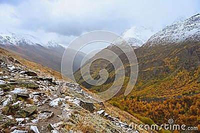 Autumn trail to Lake Donguzorun Kol along the mountainside Stock Photo