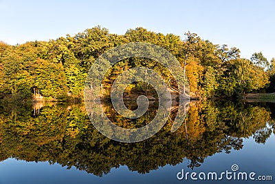 Autumn trees are reflected in the lake Stock Photo