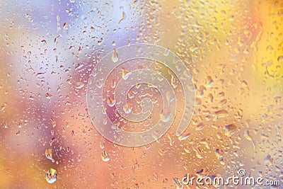 Autumn window with the texture of water drops. Glass background with raindrops Stock Photo