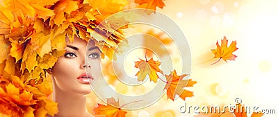 Autumn woman. Beauty model girl with autumn bright leaves hairstyle Stock Photo